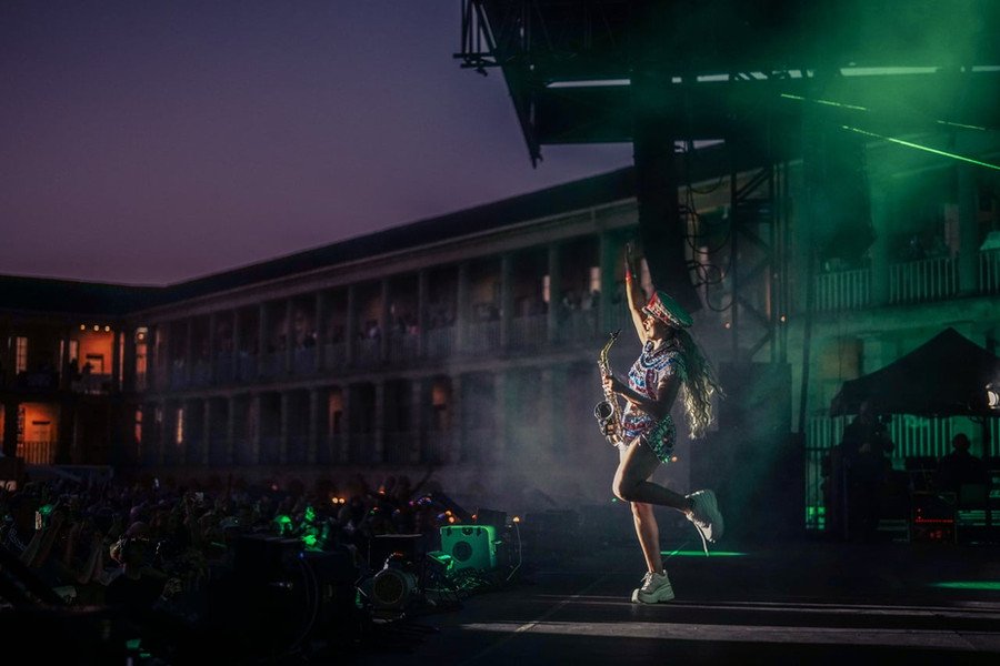 Ellie Sax green haze stage silhouette