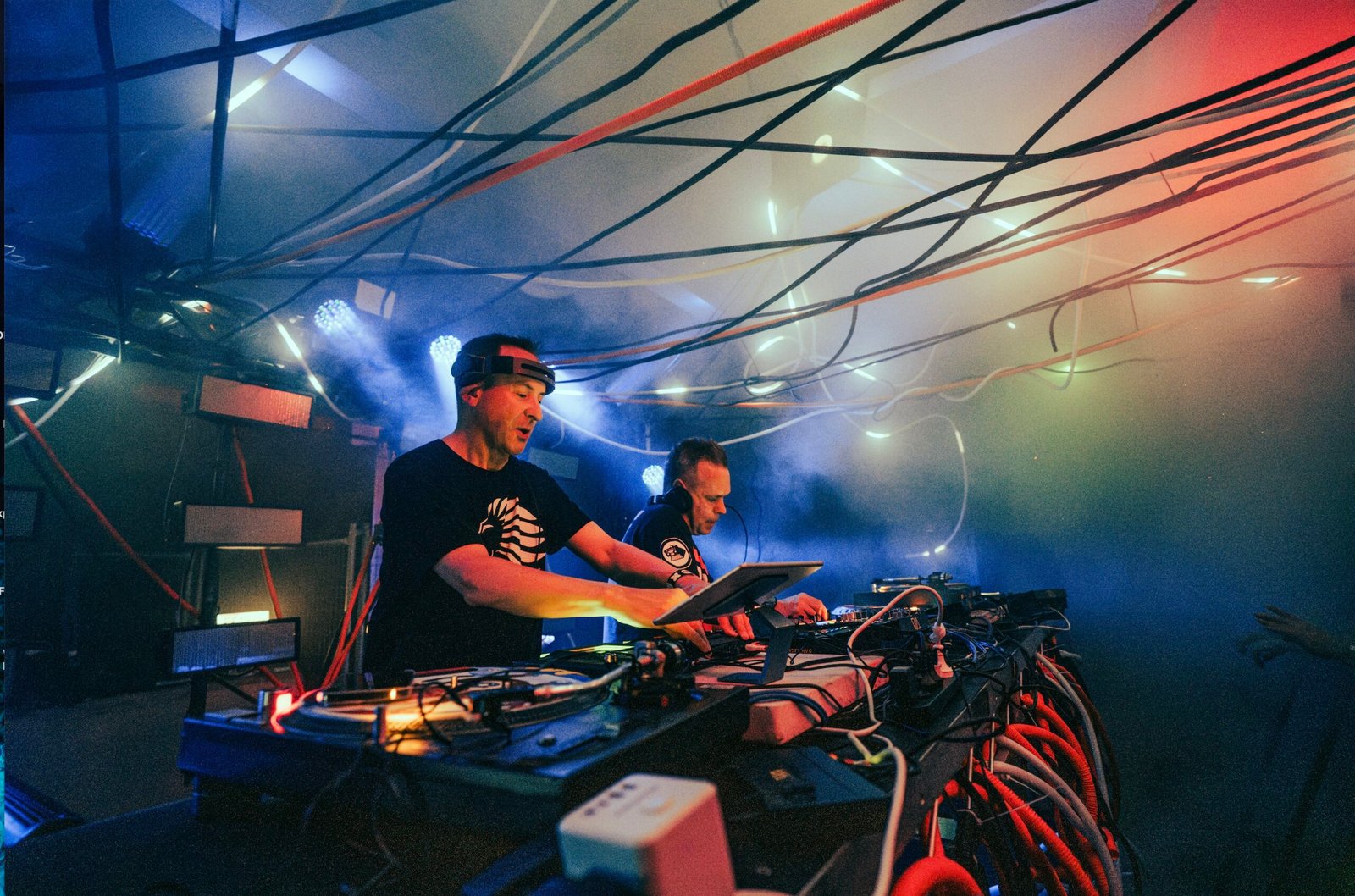 Utah Saints playing a DJ set in a nightclub