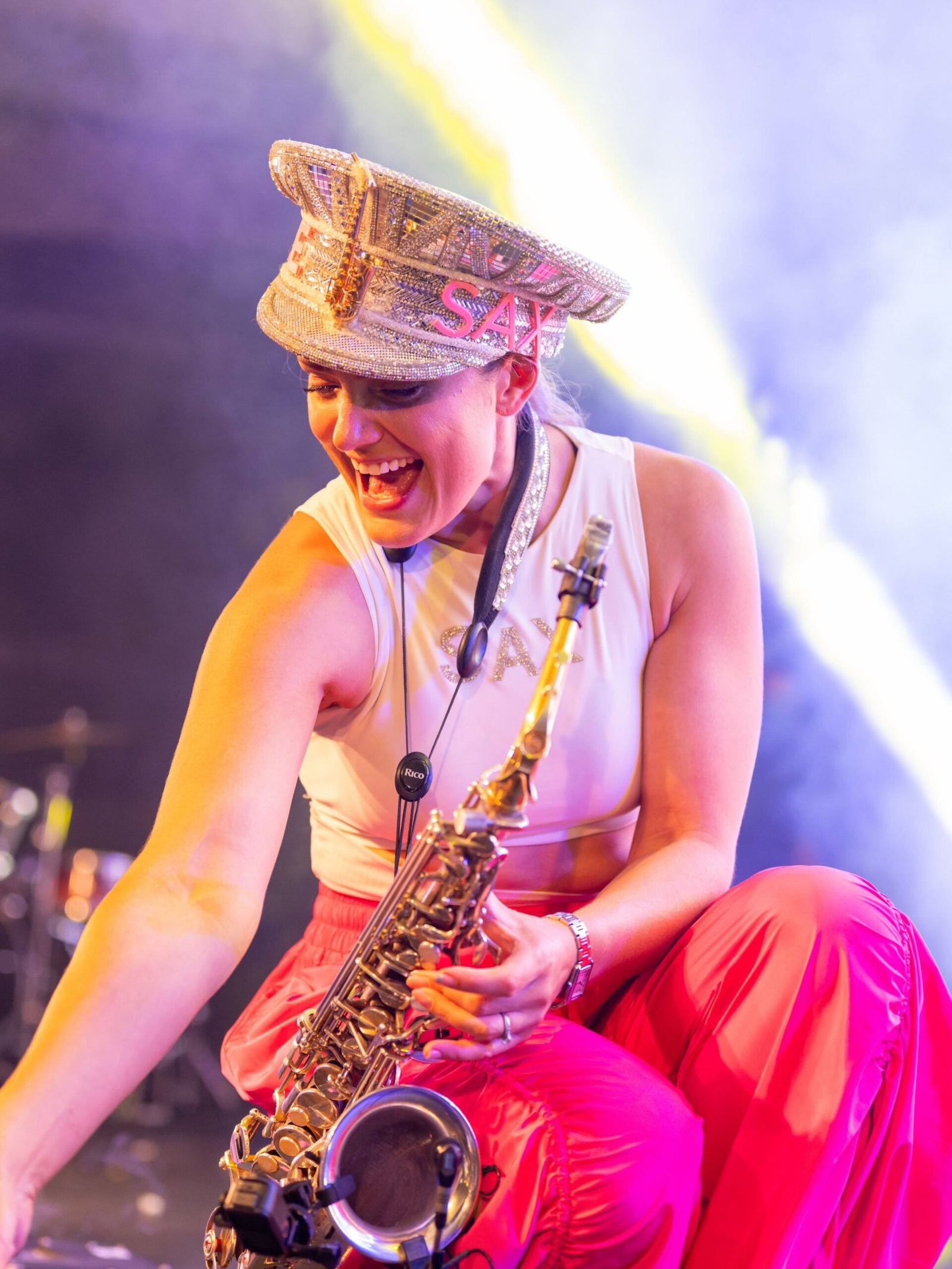 Ellie Sax with her saxophone interacting with the crowd